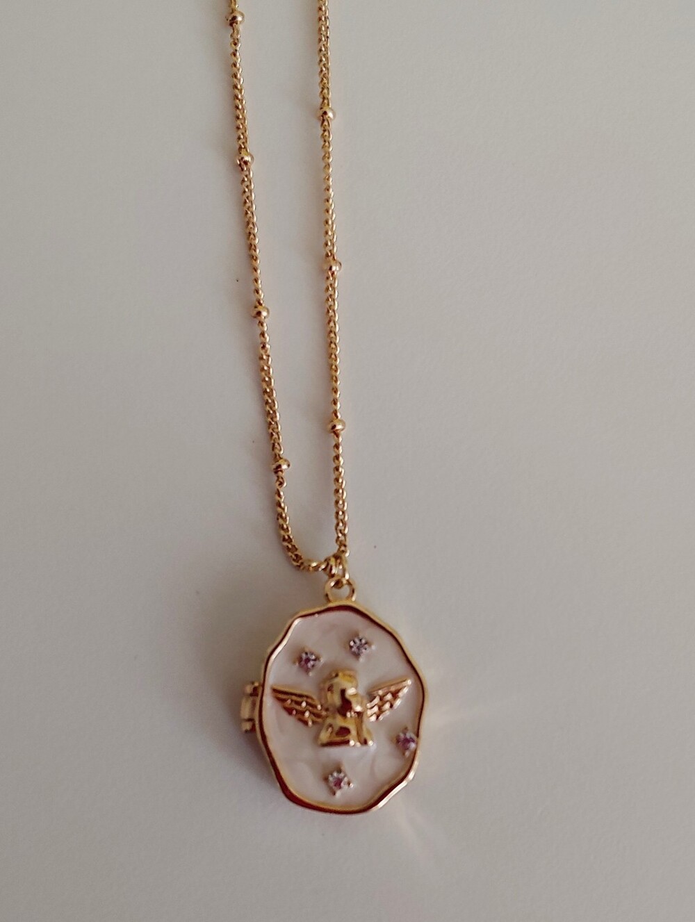 Gold-tone Mother of Pearl Angel Locket Necklace - Women's Jewelry